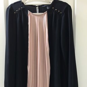 Black blouse with pink pleats and gold studs